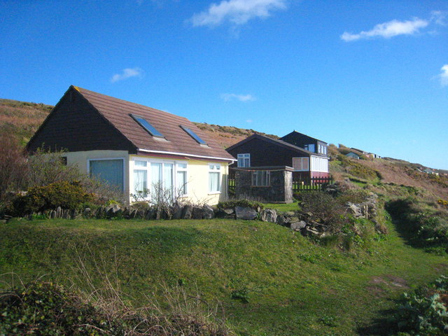 Bungalows by the Military Road at Whitesand Bay Photo | UK Beach Guide